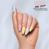 Close-up of a model's hand wearing Salon Perfect 346 Viral Nail Edit Lemon Press On Nail.